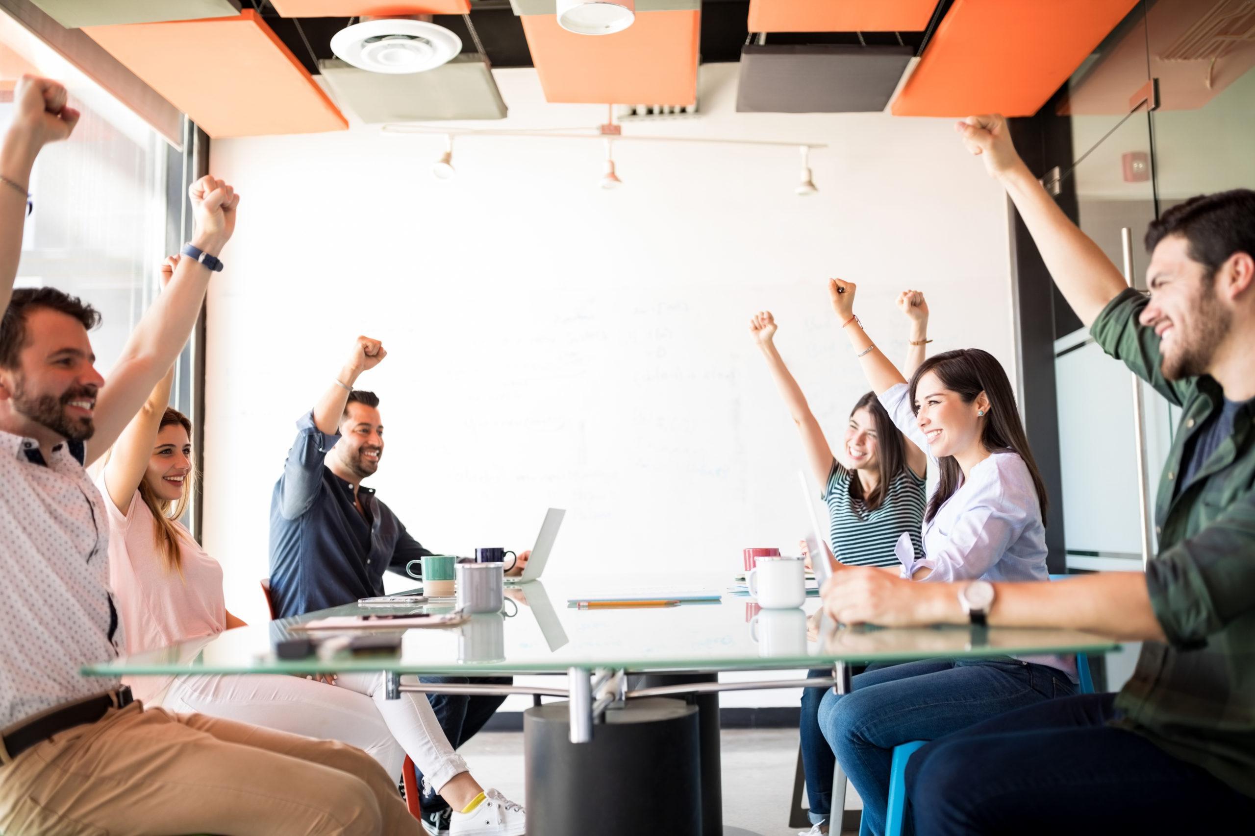 Positive and ambitious business team in meeting room